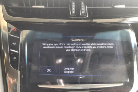 Cadillac CUE do not take eyes off road warning-Cuescreens