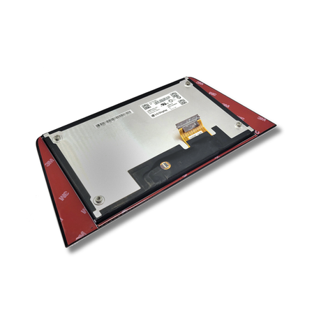 Back of electronic touchscreen with a ribbon cable on a white background